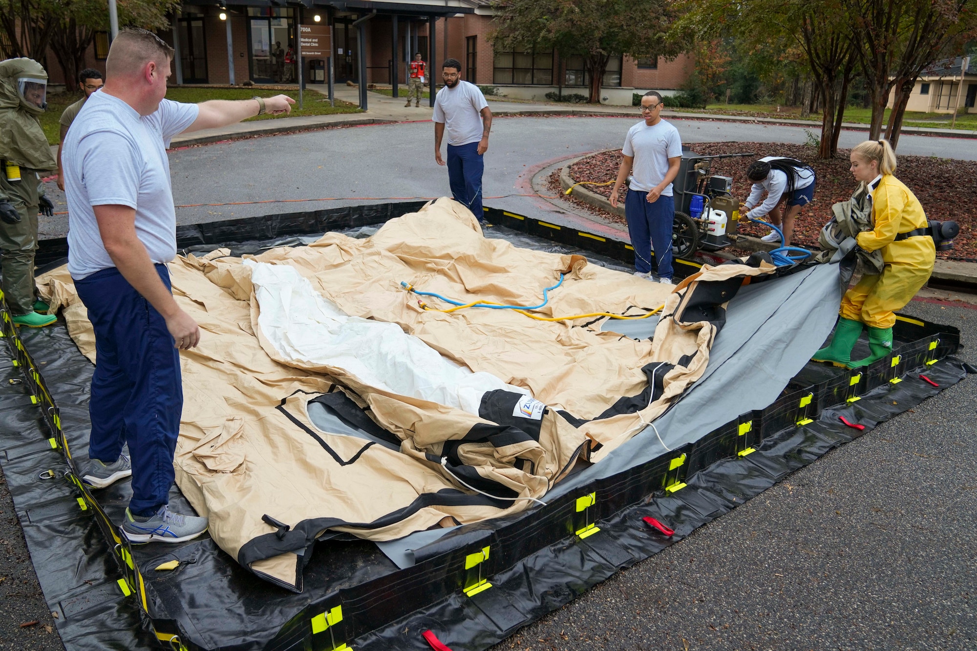 Members of the 78th Medical Group prepare an inflatable decontamination wash down tent prior to a mass casualty decontamination drill conducted at Robins Air Force Base, Georgia, Nov. 20, 2024