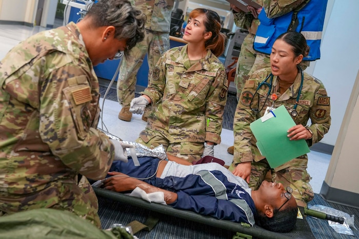 Capt. Elizabeth Lee, 78th Medical Group physician assistant, provides medical treatment to a triaged patient during a mass casualty decontamination exercise conducted at Robins Air Force Base, Georgia, Nov. 20, 2024