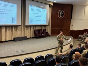 The Defense Logistics Agency’s Deputy Army Senior Service Integrator Maj. Daniel Marvin, center, provides a DLA overview brief to over 100 Army captains attending the Logistics Captain’s Career Course