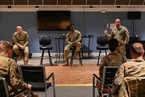 Military members gather for a meeting.