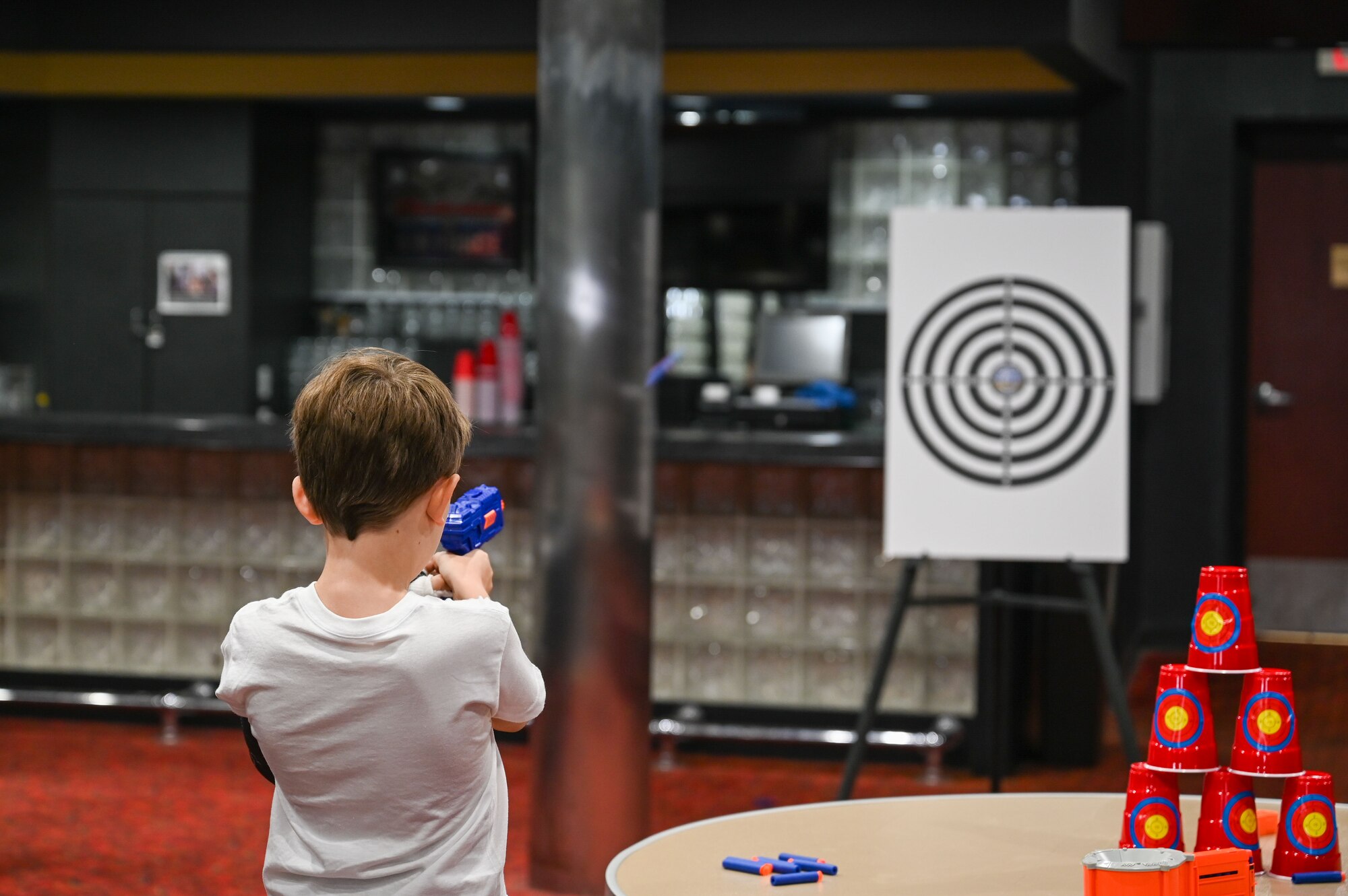 A child points nerf gun at target. (U.S. Air Force photo by Senior Airman Abigayl Salyer)