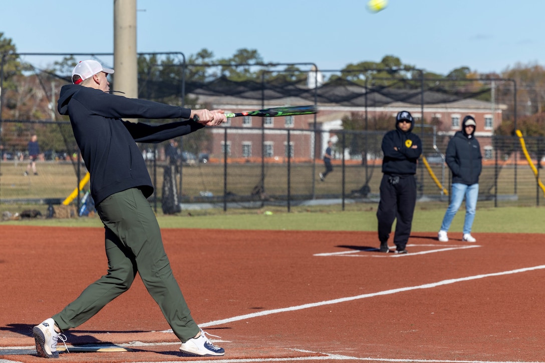 U.S. Marine Corps Lt. Col. James Harvey, a native of Locust Grove, Virginia, and the operations officer of 10th Marine Regiment, 2d Marine Division, participates in a game of softball during the Big Stix sports tournament on Marine Corps Base Camp Lejeune, North Carolina, Nov. 22, 2024. The Big Stix sports tournament is an annual event hosted by 10th Marine Regiment, 2d MARDIV, to promote unit cohesion, morale, and esprit de corps. (U.S. Marine Corps photo by Lance Cpl. Jacob Claudell)