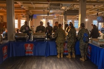 U.S. Marine Corps Brig. Gen. James A. Ryans II, the commanding general of Marine Corps Recruit Depot San Diego and the Western Recruiting Region, and leaders from Headquarters and Service Battalion, serve food to Marines at a friendsgiving event coordinated by the Depot Single Marine Program at Marine Corps Recruit Depot San Diego, California, Nov. 20, 2024. Friendsgiving is part of Spiritual Fitness Month, The Depot celebrated Spiritual Fitness Month, a program implemented to bring inner strength from higher purpose, with a friendsgiving event. MCRDSD is the first Marine Corps base to implement the Spiritual Fitness Month program. (U.S. Marine Corps photo by Cpl. Alexander O. Devereux)