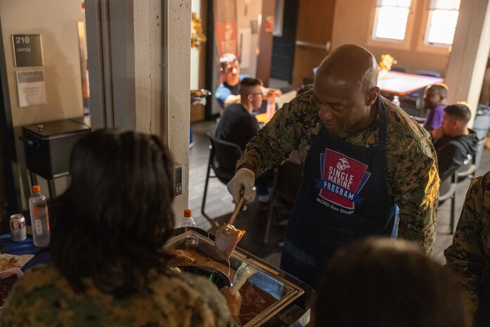 U.S. Marine Corps Brig. Gen. James A. Ryans II, the commanding general of Marine Corps Recruit Depot San Diego and the Western Recruiting Region, serves food to Marines at a friendsgiving event coordinated by the Depot Single Marine Program at Marine Corps Recruit Depot San Diego, California, Nov. 20, 2024. Friendsgiving is part of Spiritual Fitness Month, The Depot celebrated Spiritual Fitness Month, a program implemented to bring inner strength from higher purpose, with a friendsgiving event. MCRDSD is the first Marine Corps base to implement the Spiritual Fitness Month program. (U.S. Marine Corps photo by Cpl. Alexander O. Devereux)