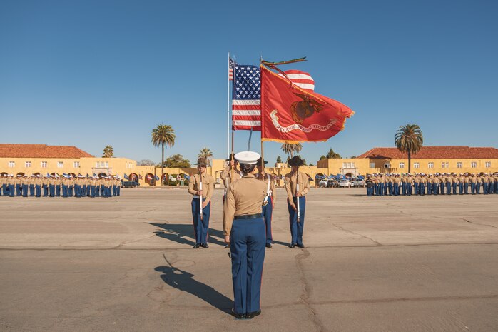 U.S. Marines assigned to the Recruit Training Regiment Color Guard, Marine Corps Recruit Depot San Diego, present the colors during the Alpha Company, 1st Recruit Training Battalion, graduation ceremony at MCRD San Diego, California, Nov. 22, 2024. This ceremony marked the end of a 13-week transformation that included training in drill, marksmanship, basic combat skills, and Marine Corps customs and traditions. (U.S. Marine Corps photo by Lance Cpl. Janell B. Alvarez)