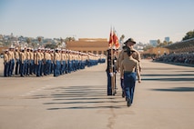 U.S. Marine Corps drill instructors with Alpha Company, 1st Recruit Training Battalion, march in formation prior to returning the guidon during a graduation ceremony at Marine Corps Recruit Depot San Diego, California, Nov. 22, 2024. This ceremony marked the end of a 13-week transformation that included training in drill, marksmanship, basic combat skills, and Marine Corps customs and traditions. (U.S. Marine Corps photo by Lance Cpl. Janell B. Alvarez)