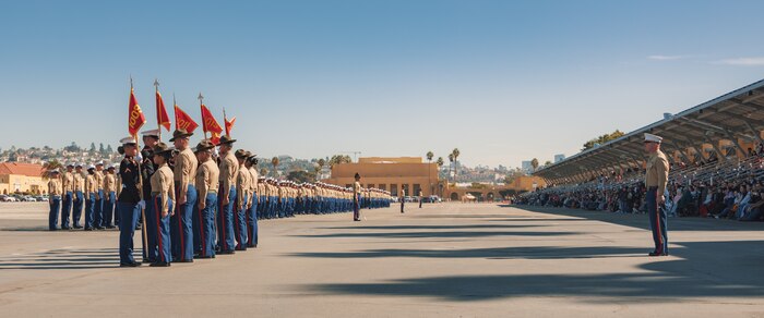 U.S. Marines with Alpha Company, 1st Recruit Training Battalion, return the guidon during a graduation ceremony at Marine Corps Recruit Depot San Diego, California, Nov. 22, 2024. This ceremony marked the end of a 13-week transformation that included training in drill, marksmanship, basic combat skills, and Marine Corps customs and traditions. (U.S. Marine Corps photo by Lance Cpl. Janell B. Alvarez)