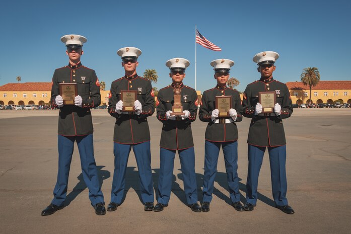 U.S. Marines with Alpha Company, 1st Recruit Training Battalion, pose for a photo after a graduation ceremony at Marine Corps Recruit Depot San Diego, California, Nov. 22, 2024. This ceremony marked the end of a 13-week transformation that included training in drill, marksmanship, basic combat skills, and Marine Corps customs and traditions. (U.S. Marine Corps photo by Lance Cpl. Janell B. Alvarez)