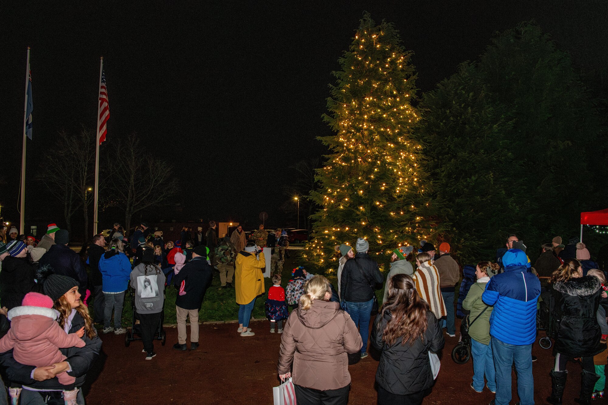 Community members gather for a tree lighting ceremony