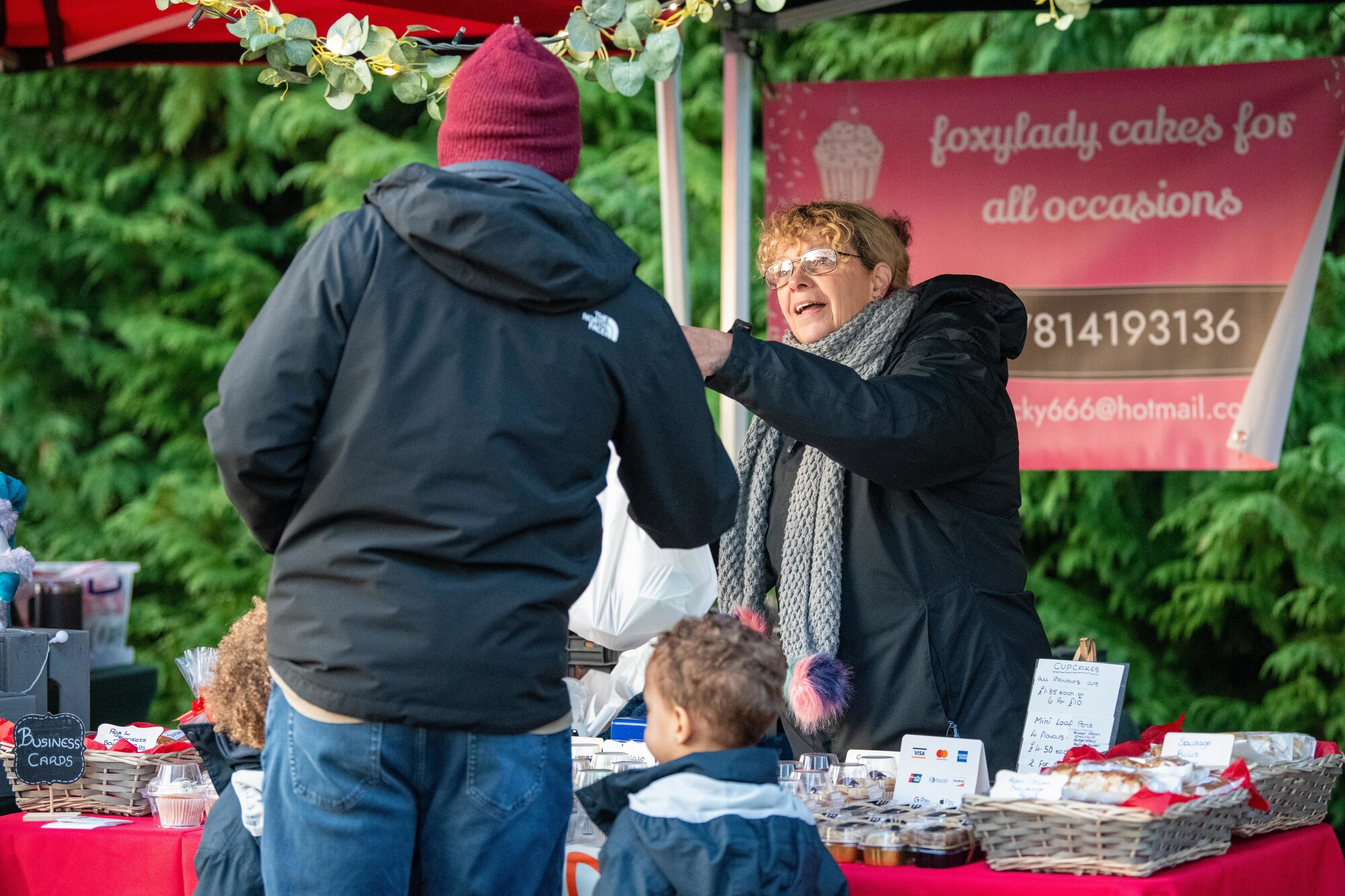A shopper collects goodies at a holiday market