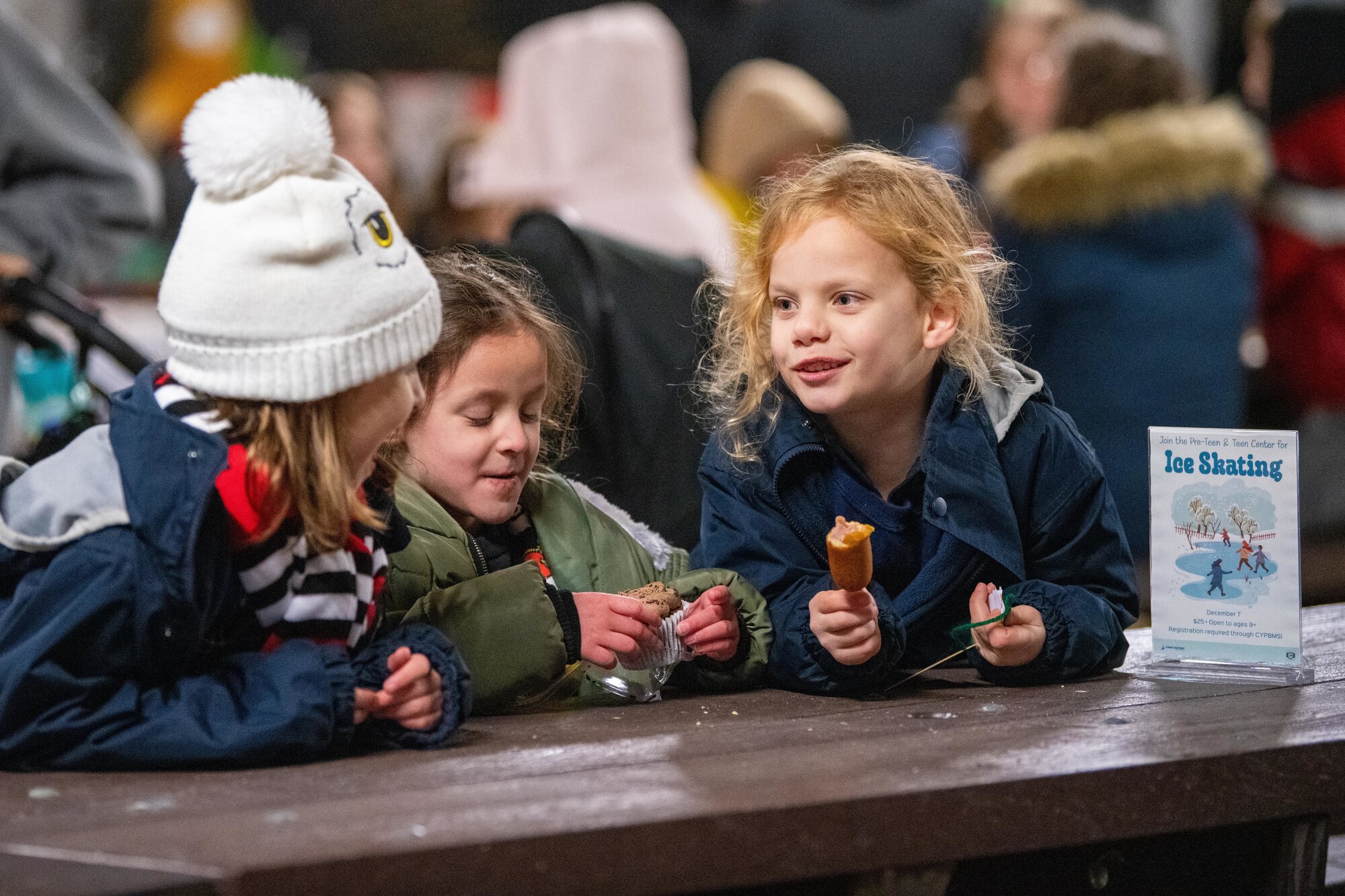 Children talk during a holiday market