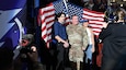 The Tampa Bay Lightning honored AR-MEDCOM Public Affairs Officer Lt. Col. William L. Geddes, posing with his son John and wife Anne, at Friday night's game with the New Jersey Devils--part of the USAA 