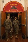 U.S. Marine Corps Maj. Gen. James B. Wellons, left, commanding general of 3rd Marine Aircraft Wing, tours drill instructor school with Maj. Priscilla A. Malone, drill instructor school director with Recruit Training Regiment, Marine Corps Recruit Depot San Diego during a visit at MCRD San Diego and Western Recruiting Region, California, Nov. 18, 2024. Wellons and his staff visited MCRD San Diego to observe training and learn how MCRDSD and WRR operates. (U.S. Marine Corps photo by Lance Cpl. Janell B. Alvarez)