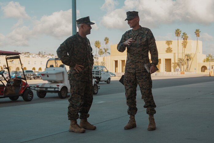 U.S Marine Corps Maj. Gen. James B. Wellons, left, commanding general of 3rd Marine Aircraft Wing, and Col. Peter M. Rummler, right, the commanding officer of Recruit Training Regiment, Marine Corps Recruit Depot San Diego converse during a visit at MCRD San Diego and Western Recruiting Region, California, Nov. 18, 2024. Wellons and his staff visited MCRD San Diego to observe training and learn how MCRD-SD and WRR operates. (U.S. Marine Corps photo by Lance Cpl. Janell B. Alvarez)