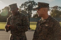 U.S Marine Corps Brig. Gen. James A. Ryans II, left, commanding general Marine Corps Recruit Depot San Diego and the Western Recruiting Region, receives a coin from Maj. Gen. James B. Wellons, commanding general of 3rd Marine Aircraft Wing, during a visit at MCRD San Diego and Western Recruiting Region, California, Nov. 18, 2024. Wellons and his staff visited MCRD San Diego to observe training and learn how MCRD-SD and WRR operates. (U.S. Marine Corps photo by Lance Cpl. Janell B. Alvarez)