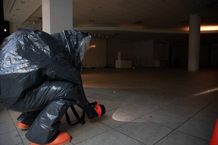 A member of the Massachusetts National Guard 1st Weapons of Mass Destruction Civil Support Team looks for signs of contamination during an evaluation training event at the Emerald Square Mall Nov. 7, 2024. The CST was tested over two days in North Attleboro.