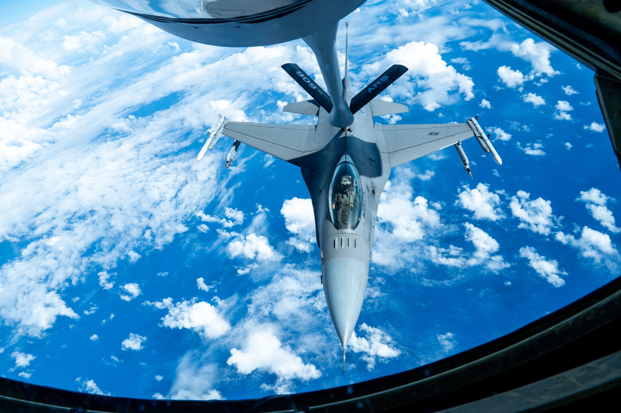 An aircraft conducts aerial refueling.