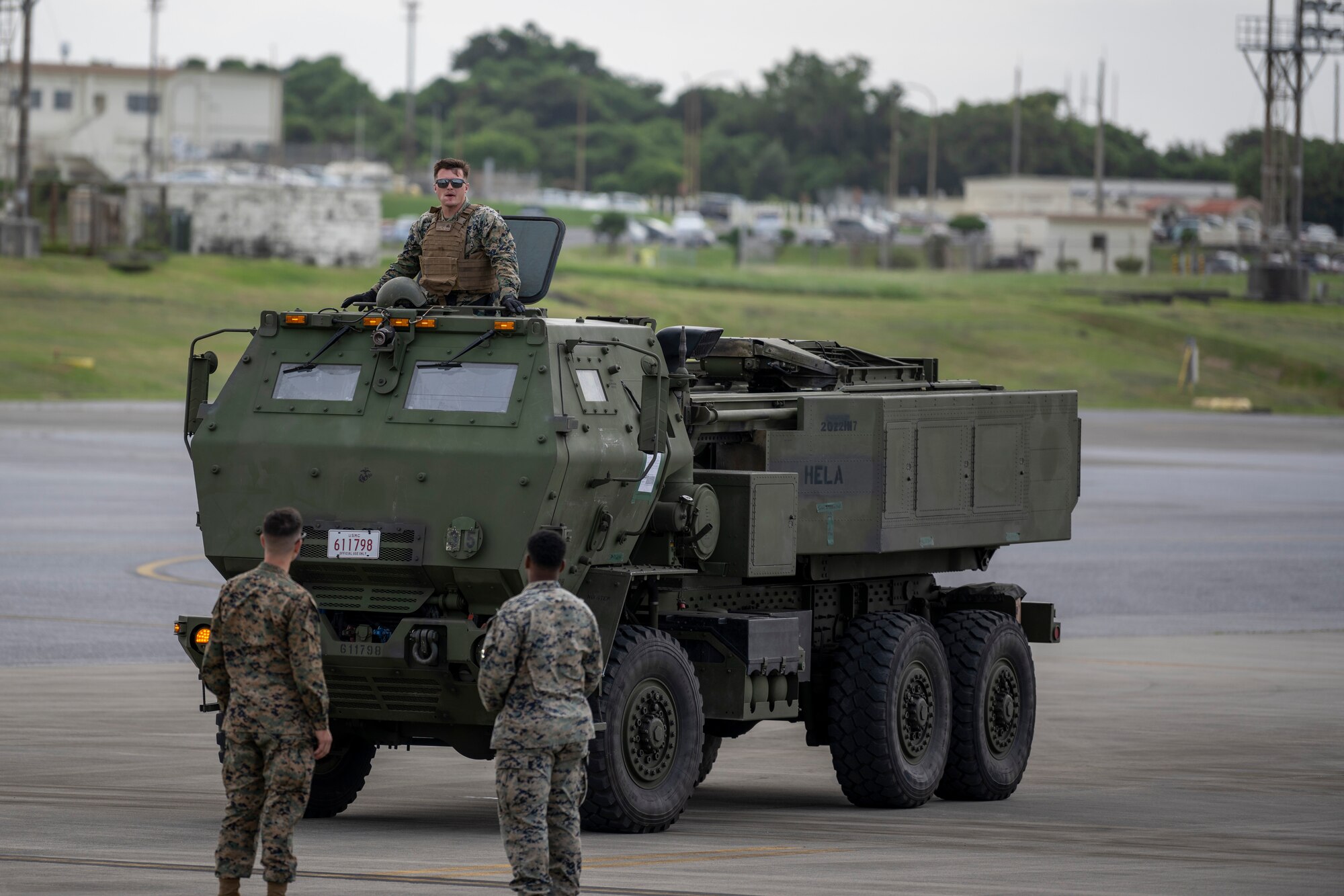 U.S. Marines drive a vehicle on to a C-17 Globemaster III