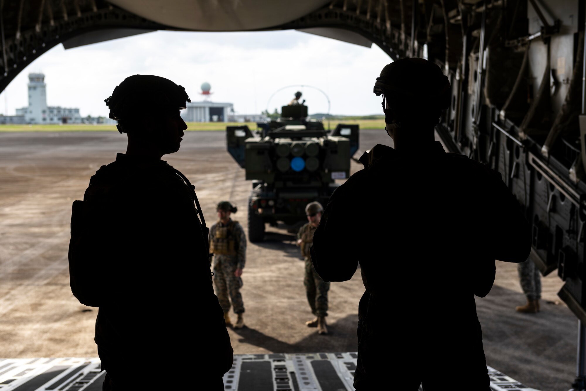 Marines offload a vehicle from a C-17 Globemaster III
