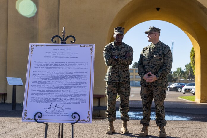 U.S. Navy Chaplain Rear Adm. Carey Cash, chaplain of the Marine Corps, and U.S. Marine Corps Brig. Gen. James A. Ryans II, commanding general of Marine Corps Recruit Depot San Diego and the Western Recruiting Region, speak after signing a declaration of commitment to spiritual fitness, during the kick-off to spiritual fitness month at Marine Corps Recruit Depot San Diego, California, Nov. 4, 2024. The Depot celebrated Spiritual Fitness Month, a program implemented to bring inner strength from higher purpose, with a spiritual fitness proclamation signing. MCRDSD is the first Marine Corps base to implement the Spiritual Fitness Month program. (U.S. Marine Corps photo by Cpl. Alexander O. Devereux)