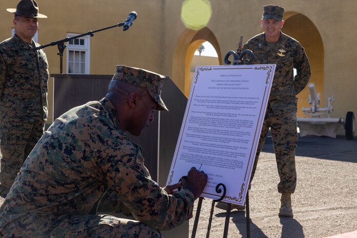 U.S. Marine Corps Brig. Gen. James A. Ryans II, commanding general of Marine Corps Recruit Depot San Diego and the Western Recruiting Region, signs a proclamation of spiritual fitness month, during the kick-off to spiritual fitness month at Marine Corps Recruit Depot San Diego, California, Nov. 4, 2024. The Depot celebrated Spiritual Fitness Month, a program implemented to bring inner strength from higher purpose, with a spiritual fitness proclamation signing. MCRDSD is the first Marine Corps base to implement the Spiritual Fitness Month program. (U.S. Marine Corps photo by Cpl. Alexander O. Devereux)