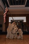 U.S. Marines with Marine Corps Recruit Depot San Diego, participate in a reenactment of the Iwo Jima flag raising during a birthday ball ceremony in San Diego, California, Nov. 8, 2024. A celebration of the 249th Marine Corps birthday was held to reflect on the traditions, history and legacy of the Marine Corps. (U.S. Marine Corps photo by Lance Cpl. Janell B. Alvarez)