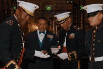 U.S. Marine Corps Brig. Gen. James Ryans II, commanding general of Marine Corps Recruit Depot San Diego and Western Recruiting Region, presents cake to the oldest Marine present during a birthday ball ceremony in San Diego, California, Nov. 8, 2024. A celebration of the 249th Marine Corps birthday was held to reflect on the traditions, history and legacy of the Marine Corps. (U.S. Marine Corps photo by Lance Cpl. Janell B. Alvarez)