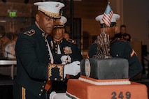 U.S. Marine Corps Brig. Gen. James Ryans II, commanding general of Marine Corps Recruit Depot San Diego and Western Recruiting Region, cuts the traditional cake during a birthday ball ceremony in San Diego, California, Nov. 8, 2024. A celebration of the 249th Marine Corps birthday was held to reflect on the traditions, history and legacy of the Marine Corps. (U.S. Marine Corps photo by Lance Cpl. Janell B. Alvarez)