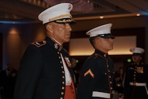 U.S. Marine Corps Col. David Arenas, the oldest Marine present, left, and Pfc. Isaiah Escobar, the youngest Marine present with Marine Corps Recruit Depot San Diego, stands during a birthday ball ceremony in San Diego, California, Nov. 8, 2024. A celebration of the 249th Marine Corps birthday was held to reflect on the traditions, history and legacy of the Marine Corps. (U.S. Marine Corps photo by Lance Cpl. Janell B. Alvarez)