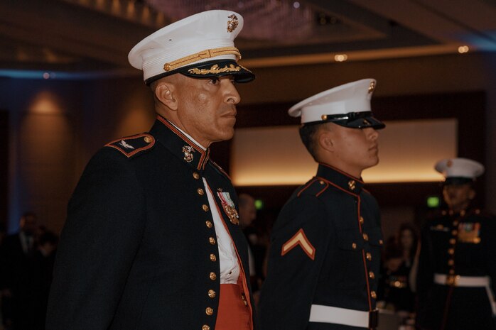 U.S. Marine Corps Col. David Arenas, the oldest Marine present, left, and Pfc. Isaiah Escobar, the youngest Marine present with Marine Corps Recruit Depot San Diego, stands during a birthday ball ceremony in San Diego, California, Nov. 8, 2024. A celebration of the 249th Marine Corps birthday was held to reflect on the traditions, history and legacy of the Marine Corps. (U.S. Marine Corps photo by Lance Cpl. Janell B. Alvarez)