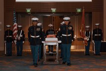 U.S. Marines with Marine Corps Recruit Depot San Diego march on the cake during a birthday ball ceremony in San Diego, California, Nov. 8, 2024. A celebration of the 249th Marine Corps birthday was held to reflect on the traditions, history and legacy of the Marine Corps. (U.S. Marine Corps photo by Lance Cpl. Janell B. Alvarez)