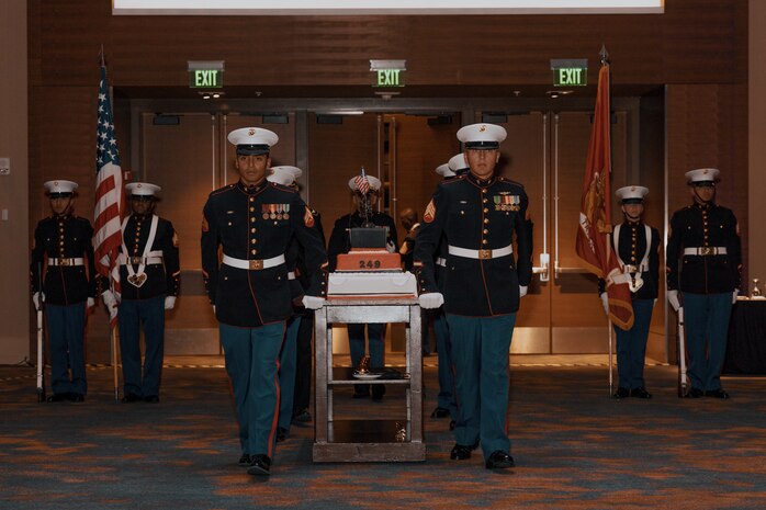 U.S. Marines with Marine Corps Recruit Depot San Diego march on the cake during a birthday ball ceremony in San Diego, California, Nov. 8, 2024. A celebration of the 249th Marine Corps birthday was held to reflect on the traditions, history and legacy of the Marine Corps. (U.S. Marine Corps photo by Lance Cpl. Janell B. Alvarez)