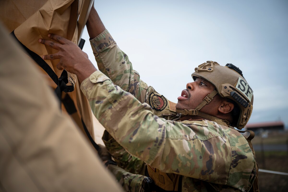 An Airman with the 821st Contingency Response helps set up a tent during a part task trainer at the Global Readiness Deployment Center on Travis Air Force Base, California, Nov. 21, 2024.