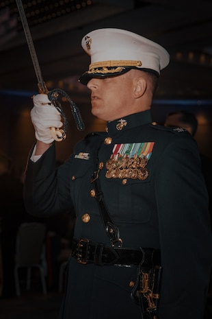 U.S. Marine Corps Col. Seth Dewey, an assistant chief of staff with Headquarters and Service Battalion, Marine Corps Recruit Depot San Diego, participates in a sword detail during a birthday ball ceremony in San Diego, California, Nov. 8, 2024. A celebration of the 249th Marine Corps birthday was held to reflect on the traditions, history and legacy of the Marine Corps. (U.S. Marine Corps photo by Lance Cpl. Janell B. Alvarez)