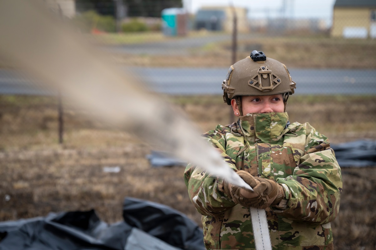 An Airman with the 821st Contingency Response helps set up a tent during a part task trainer at the Global Readiness Deployment Center on Travis Air Force Base, California, Nov. 21, 2024.