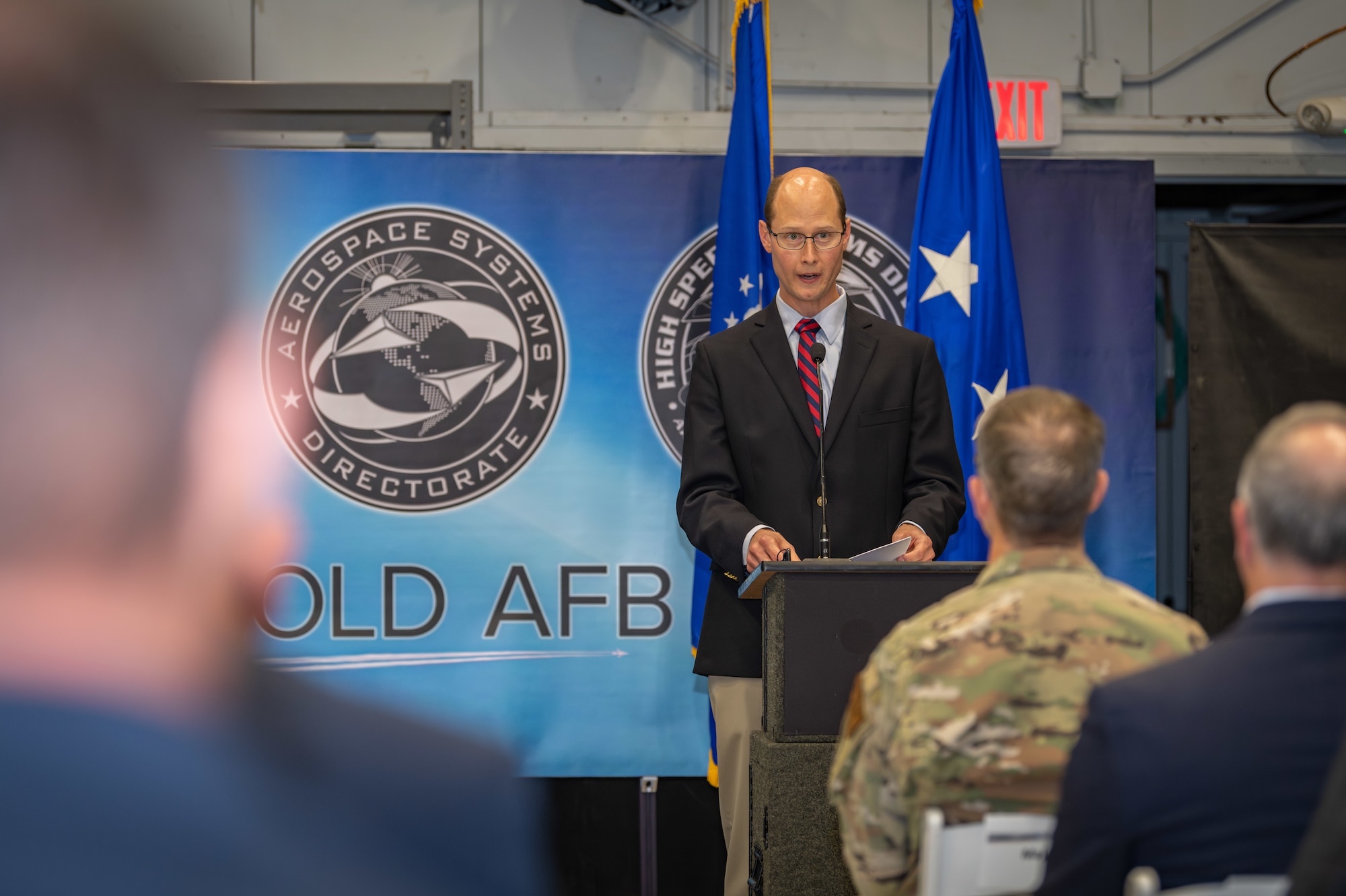 Jamie Szmodis, chief of the Air Force Research Laboratory High Speed Aerodynamics Branch at Arnold Air Force Base, Tenn., speaks during the Oct. 2, 2024, ceremony held in the von Kármán Gas Dynamics Facility at Arnold AFB to commemorate the 10th anniversary of the partnership between the AFRL and Arnold Engineering Development Complex. A unit of the AFTC, AEDC is headquartered at Arnold AFB. The partnership created the AFRL High Speed Aerodynamics Branch, which focuses on hypersonic research, at Arnold. (U.S. Air Force photo by Keith Thornburgh)