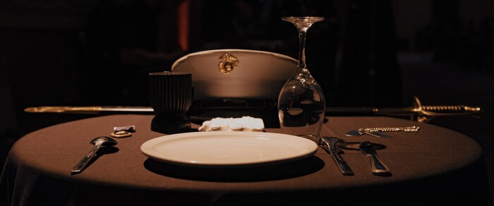 The fallen comrade table is set in remembrance of fallen and missing comrades during a birthday ball ceremony in San Diego, California, Nov. 8, 2024. The significance of the table is to honor and remember service members who have died. A celebration of the 249th Marine Corps birthday was held to reflect on the traditions, history and legacy of the Marine Corps. (U.S. Marine Corps photo by Lance Cpl. Janell B. Alvarez)