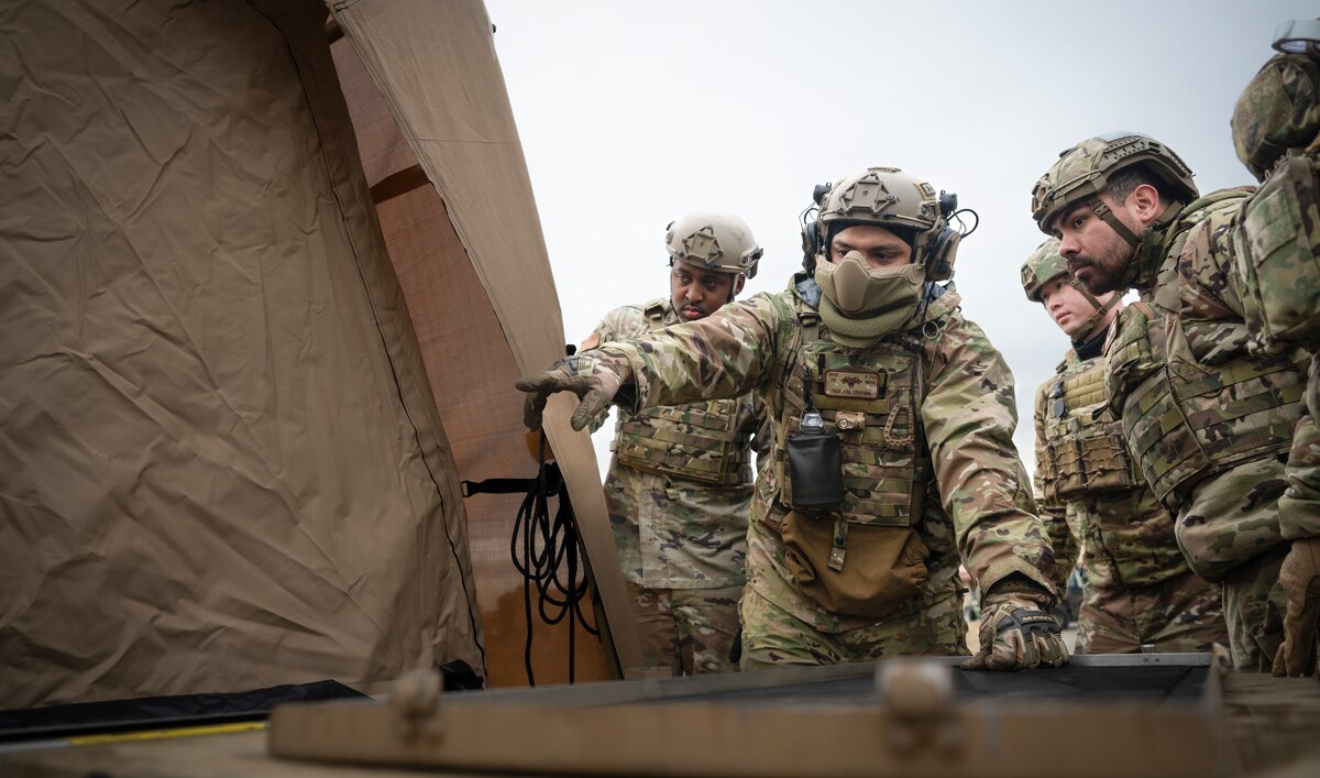 Airmen with the 821st Contingency Response set up a communication antenna during a part task trainer at the Global Readiness Deployment Center on Travis Air Force Base, California, Nov. 21, 2024.