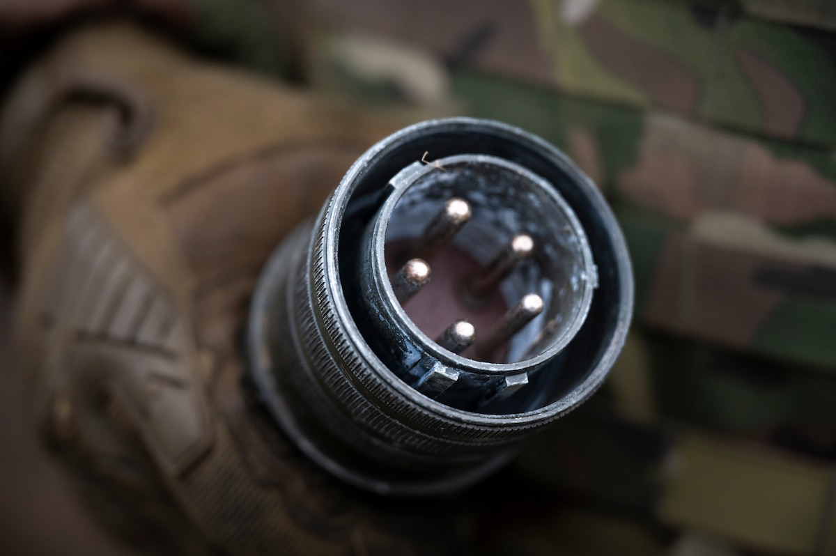 An 821st Contingency Response Squadron Airman holds a power cable during a part task trainer at the Global Readiness Deployment Center on Travis Air Force Base, California, Nov. 21, 2024