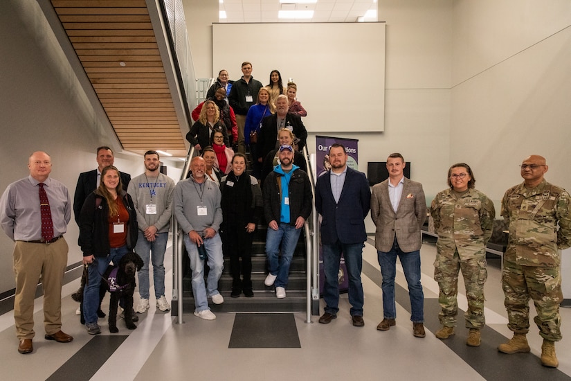 The Kentucky National Guard directorate of military support (DOMS) and members of Leadership Frankfort pose for a group photo on Boone National Guard Center in Frankfort, Kentucky on Nov. 21, 2024.  The Kentucky National Guard invited the group Leadership Frankfort to engage with local commerce leaders on the dual mission of the National Guard. (U.S. Army National Guard photos by Andy Dickson)