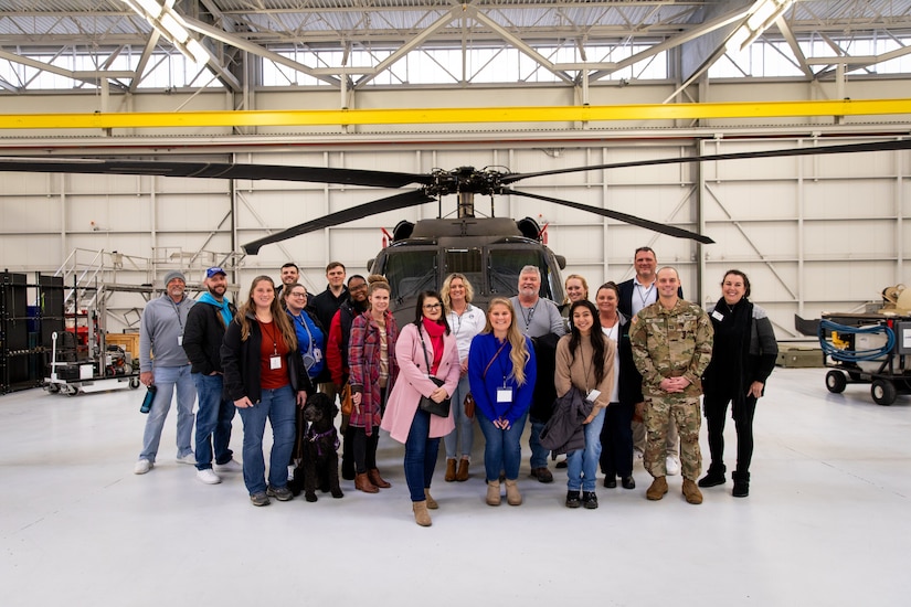 The Kentucky National Guard directorate of military support (DOMS) and members of Leadership Frankfort pose for a group photo on Boone National Guard Center in Frankfort, Kentucky on Nov. 21, 2024.  The Kentucky National Guard invited the group Leadership Frankfort to engage with local commerce leaders on the dual mission of the National Guard. (U.S. Army National Guard photos by Andy Dickson)