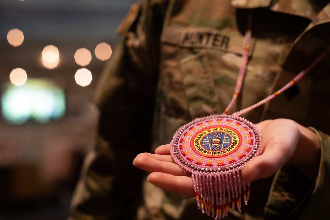 U.S. Army Spc. Brianna Hunter holds a hand-beaded necklace from the Mississippi Band of Choctaws at Murray State University in Murray, Kentucky on Nov. 25, 2024. Hunter is one-eighth Choctaw, serves in the Kentucky National Guard and is the editor-in-chief for the Murray State University newspaper and has written an article for the newspaper on her Native American Indian heritage. (U.S. Army National Guard photo by Andy Dickson)