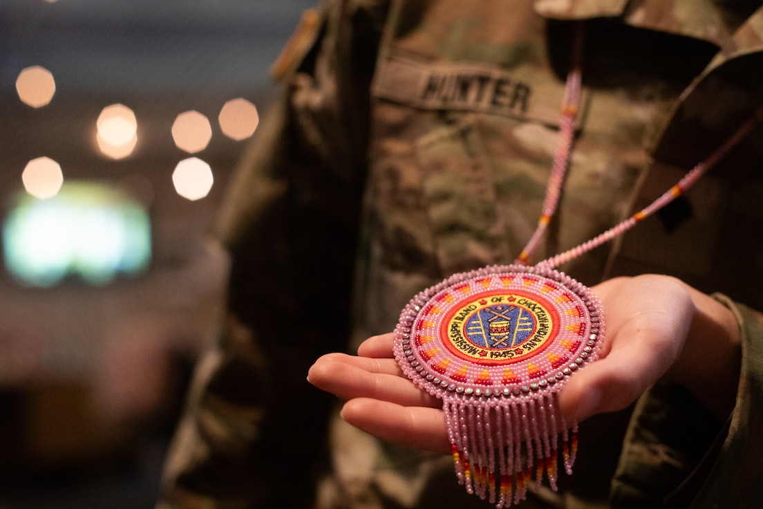 U.S. Army Spc. Brianna Hunter holds a hand-beaded necklace from the Mississippi Band of Choctaws at Murray State University in Murray, Kentucky on Nov. 25, 2024. Hunter is one-eighth Choctaw, serves in the Kentucky National Guard and is the editor-in-chief for the Murray State University newspaper and has written an article for the newspaper on her Native American Indian heritage. (U.S. Army National Guard photo by Andy Dickson)