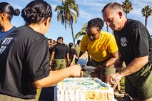 U.S. Navy Sailors with Marine Corps Recruit Depot San Diego, Recruit Training Regiment, serve cake following a U.S. Chaplain Corps birthday celebration at MCRD San Diego, California, Nov. 25, 2024. The Depot celebrated Spiritual Fitness Month, a program implemented to bring inner strength from higher purpose, with a motivational run prior to the birthday celebration. MCRDSD is the first Marine Corps base to implement the Spiritual Fitness Month program.  (U.S. Marine Corps photo by Lance Cpl. Eric Valerio)