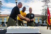U.S. Marine Corps Brig. Gen. James A. Ryans II, commanding general, Marine Corps Recruit Depot San Diego and Western Recruiting Region, middle,  U.S. Navy Lt. Tristian Engle, Headquarters and Service Battalion chaplain, left, and U.S. Navy Capt. Michael Hall, the assistant chief of staff for religious ministries of the Western Recruiting Region and the Marine Corps Recruit Depot San Diego, cut the ceremonial cake during the U.S. Navy Chaplain Corps birthday celebration at Marine Corps Recruit Depot San Diego, California, Nov. 25, 2024. The Depot celebrated Spiritual Fitness Month, a program implemented to bring inner strength from higher purpose, with a motivational run prior to the birthday celebration.  MCRDSD is the first Marine Corps base to implement the Spiritual Fitness Month program.  (U.S. Marine Corps photo by Lance Cpl. Eric Valerio)