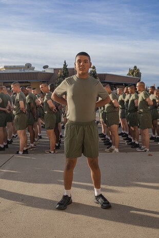 A new U.S. Marine with Golf Company, 2nd Recruit Training Battalion, from Recruiting Station Portland poses for a photo prior to the company motivational run at Marine Corps Recruit Depot San Diego, California, Nov. 25, 2024. The company motivational run is a three-mile cadence run conducted around the Depot, the last physical training event the Marines will conduct before they graduate from MCRD San Diego and the first time their friends and families will see their newly transformed U.S. Marines. (U.S. Marine Corps photo by Cpl. Alexandra M. Earl)