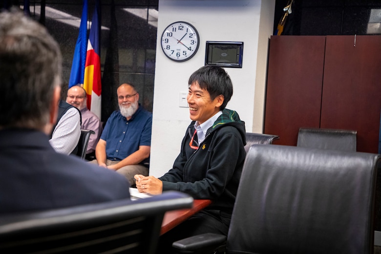 Tomoyuki Togo, a representative from the Japan Ministry of Defense who serves as a protective structure research engineer with U.S. Army Corps of Engineers, Omaha District, Protective Design – Mandatory Center of Expertise, laughs with fellow colleagues from both agencies during an engineer exchange Nov. 7, 2024, at the Edward Zorinksy Federal Building in Omaha, Nebraska.