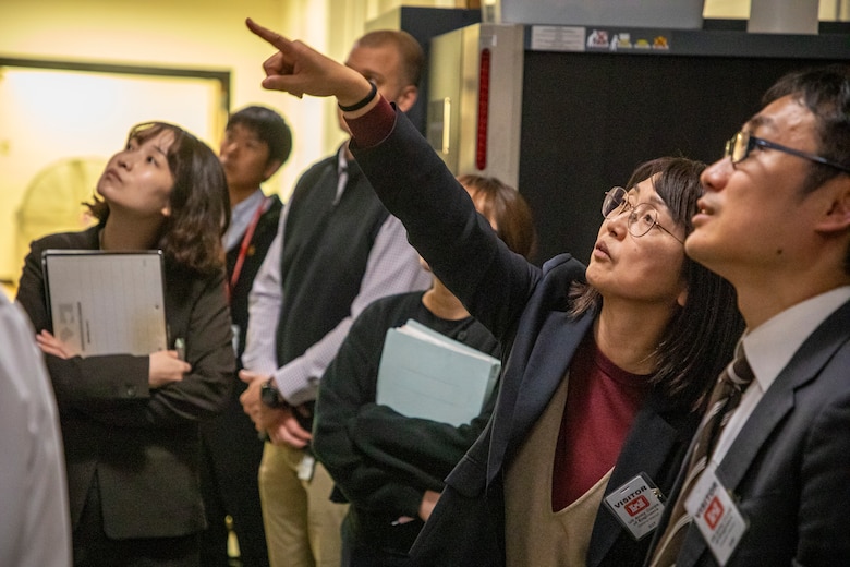 Yayoi Shiraishi, director, Protective Design and Research Office, Japan Ministry of Defense, points to some column brackets while asking a question about design during an engineer exchange Nov. 8, 2024, at the Edward Zorinksy Federal Building in Omaha, Nebraska.