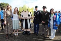U.S. Army Garrion Japan Commander Col. Marcus Hunter, third from right, and Command Sgt. Maj. David Rio, second from right, pose for a photo with Zama Mayor Mito Sato, right, and Zamarin, the city’s mascot, while attending the city’s Hometown Festival Nov. 17.