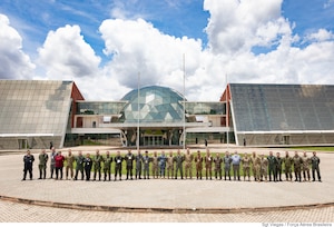 Participants of Global Sentinel 25 Mid-Planning Conference stand together for a group in front of the Brazilian Space Operations Center in Brasilia, Brazil, Nov. 21, 2024. Global Sentinel is U.S. Space Command's premier security cooperation effort designed to strengthen and grow international partnerships, improve operational collaboration and promote responsible behavior in the space domain. The MPC brought together 80 participants from 29 countries both in-person and virtually to discuss an upcoming Capstone event scheduled to begin in April 2025. This was the first time a planning conference has been hosted by a country other than the U.S.